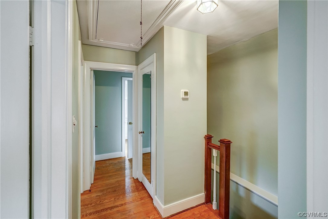 5304 Ditchley Road Richmond, VA 23226 - Photo 20 of 41 a view of a hallway with wooden floor and staircase