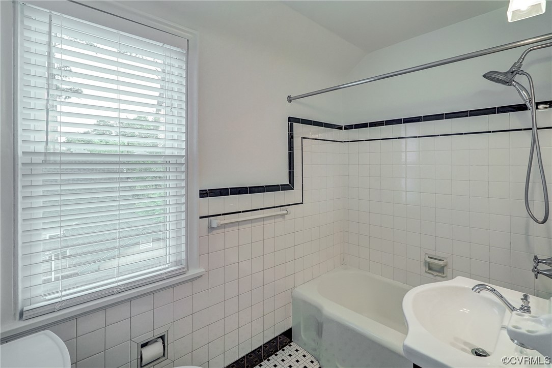 5304 Ditchley Road Richmond, VA 23226 - Photo 23 of 41 a bathroom with a sink a window and a shower