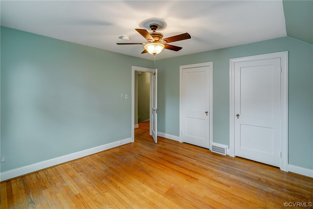 5304 Ditchley Road Richmond, VA 23226 - Photo 26 of 41 a view of a livingroom with a ceiling fan and wooden floor