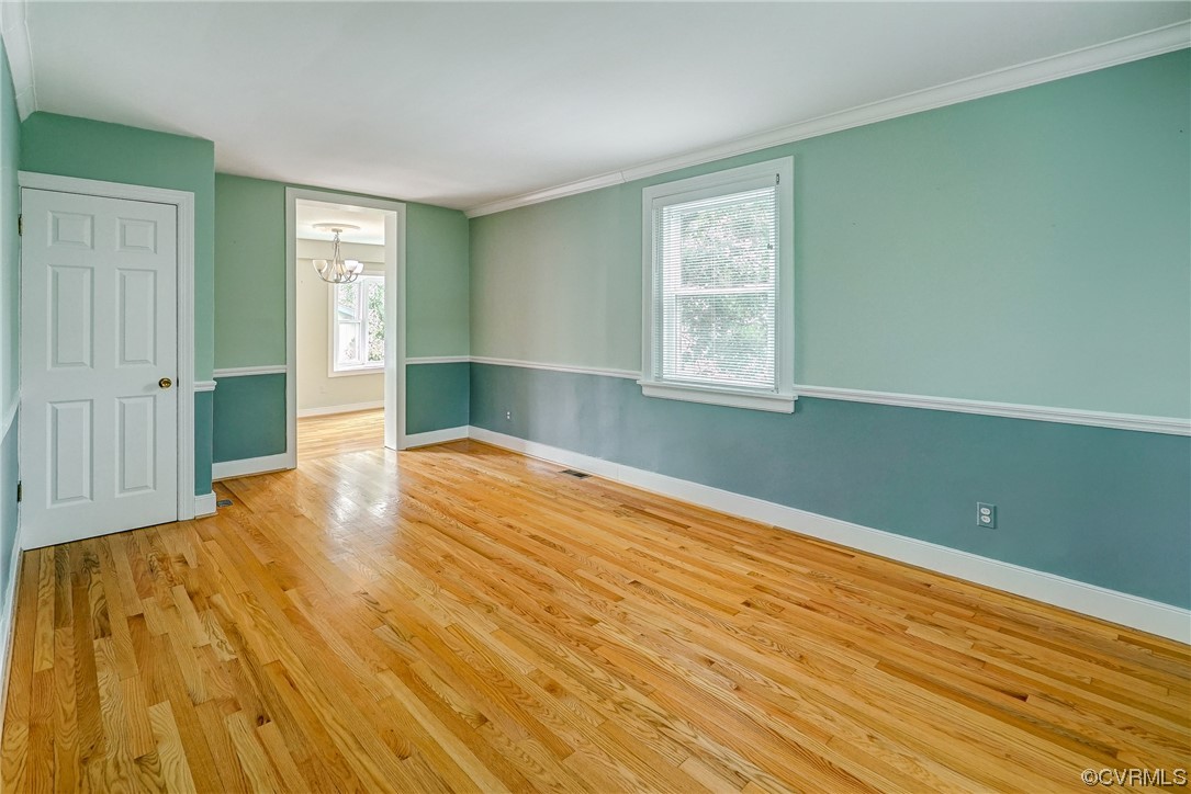 5304 Ditchley Road Richmond, VA 23226 - Photo 4 of 41 a view of empty room with wooden floor and fan