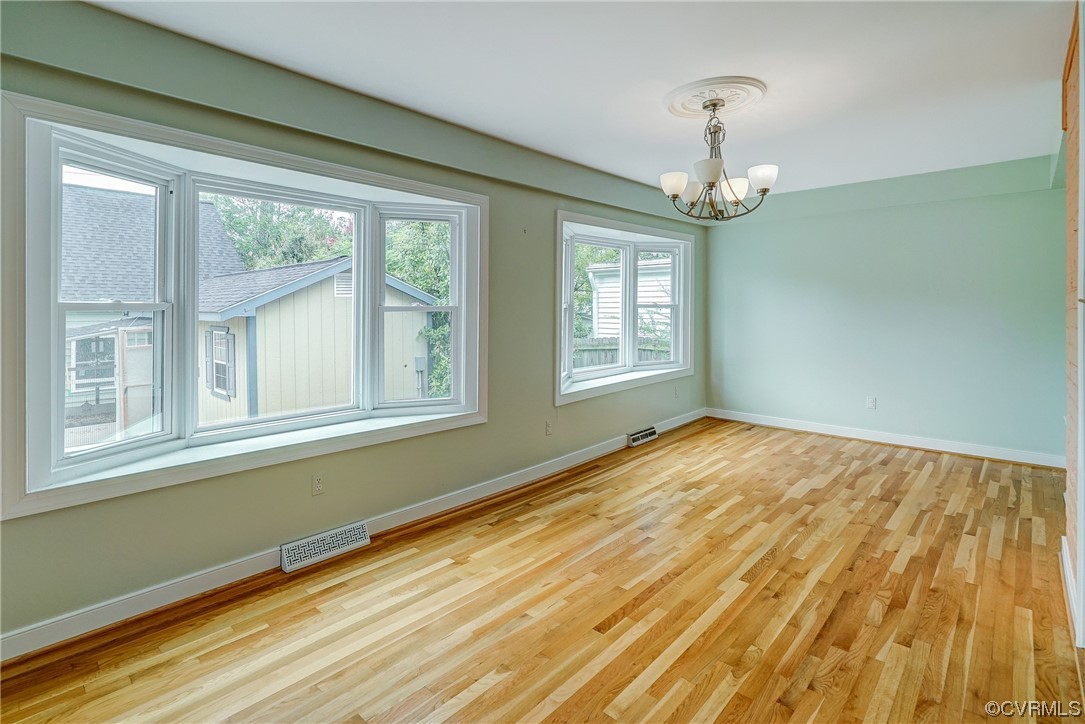 5304 Ditchley Road Richmond, VA 23226 - Photo 6 of 41 a view of empty room with wooden floor and fan