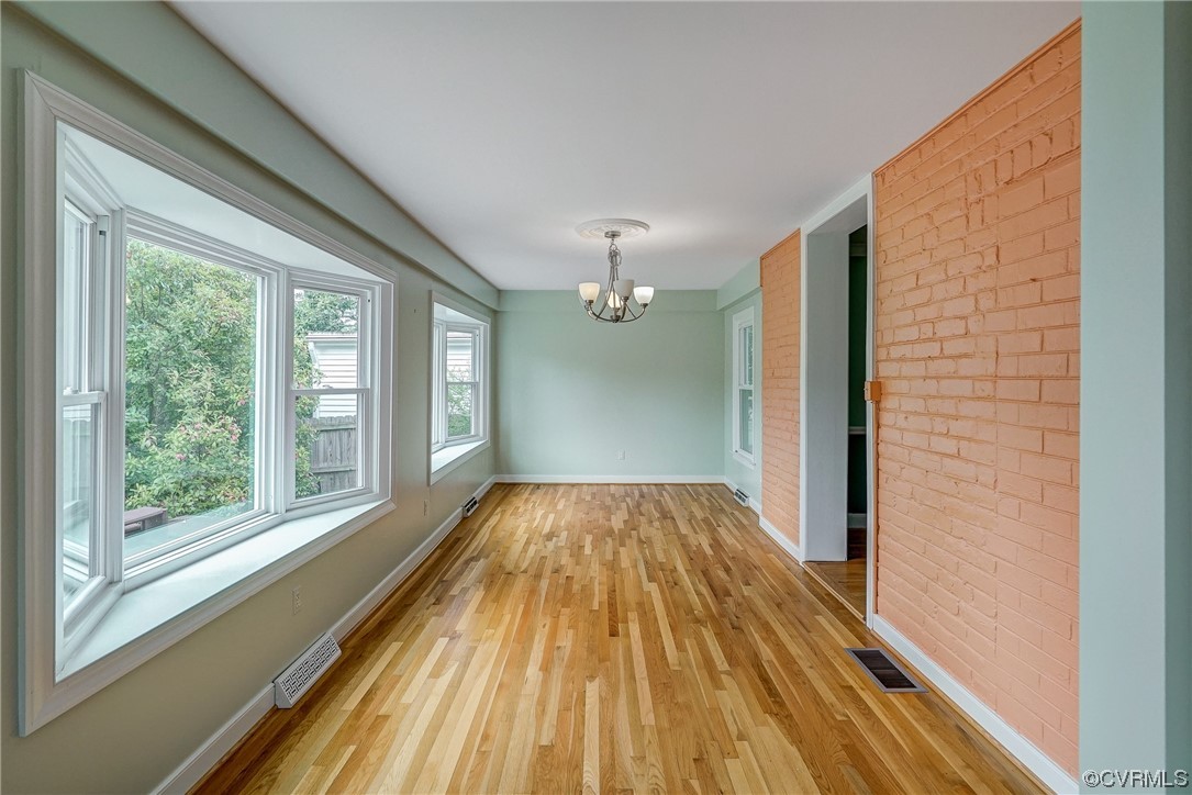 5304 Ditchley Road Richmond, VA 23226 - Photo 8 of 41 a view of empty room with wooden floor and fan
