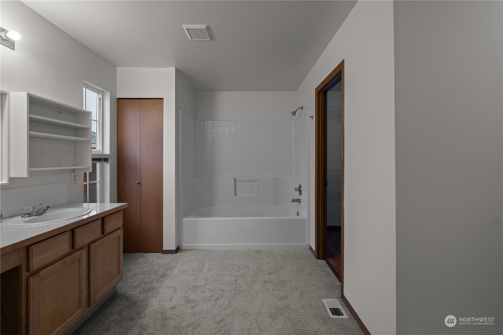2306 Southeast 3rd Street Renton, WA 98056 - Photo 19 of 34 a bathroom with a bathtub sink and mirror