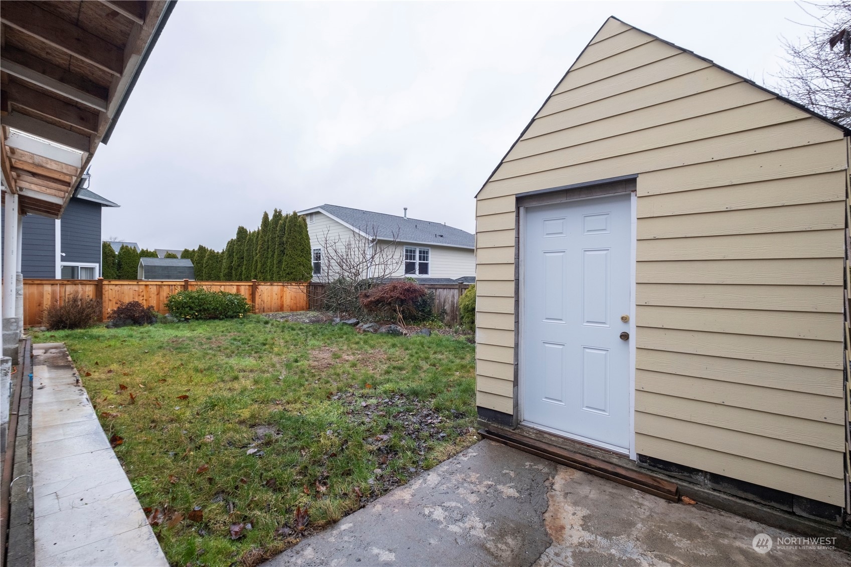 2306 Southeast 3rd Street Renton, WA 98056 - Photo 33 of 34 a view of a small house and a yard