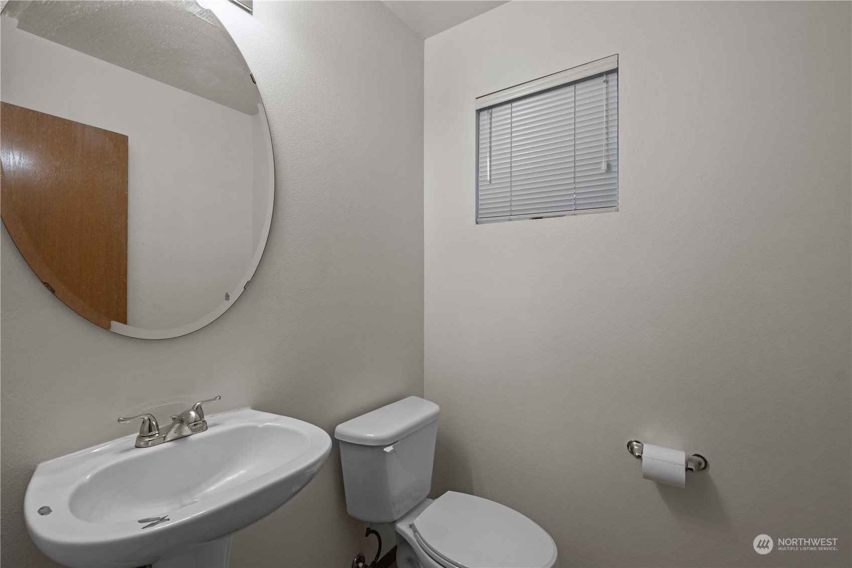 2306 Southeast 3rd Street Renton, WA 98056 - Photo 6 of 34 a bathroom with a toilet sink and mirror