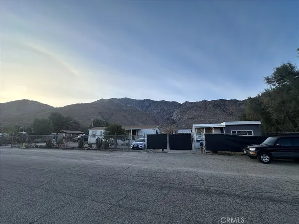 a view of house with car parked