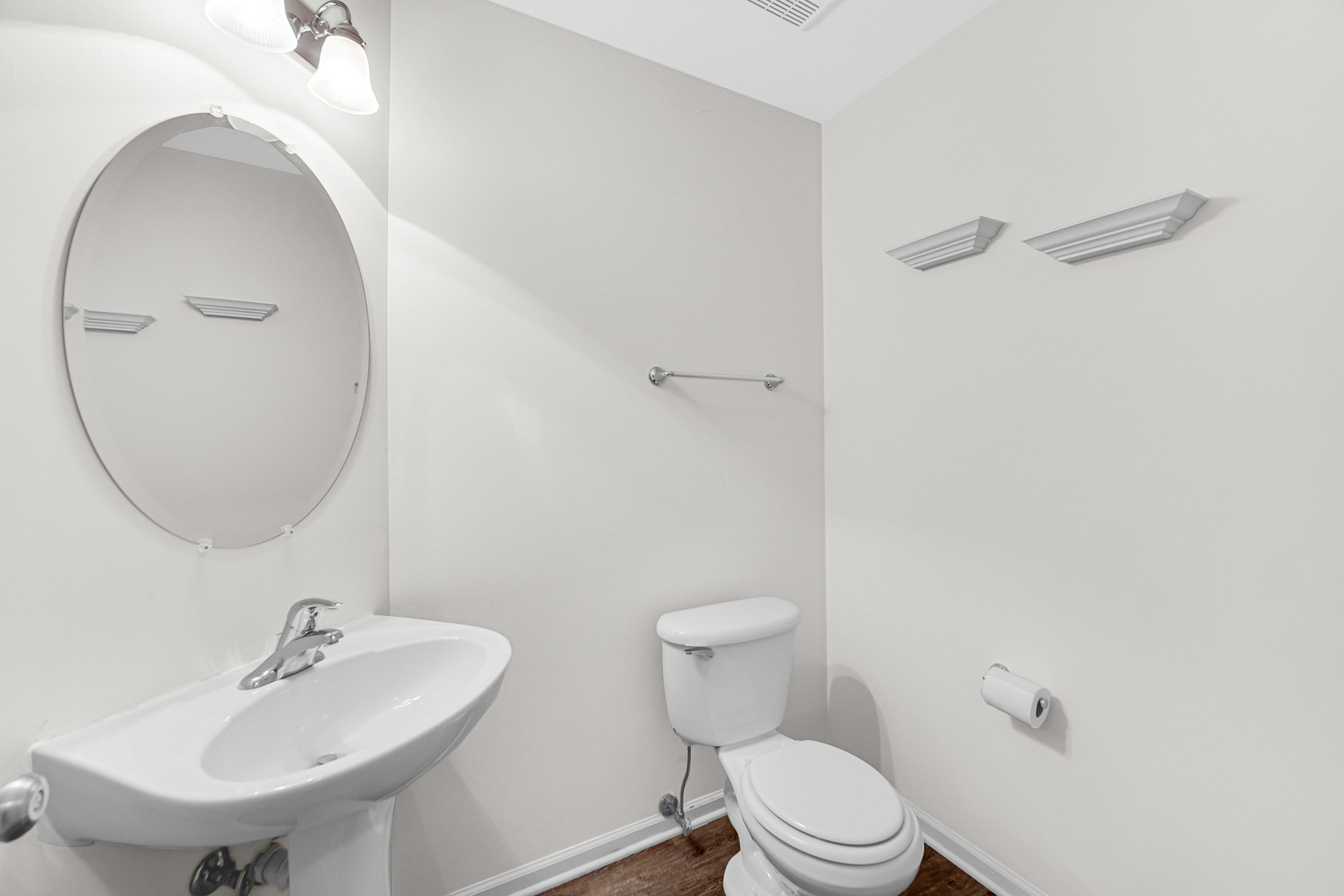 2331 Georgetown Circle Aurora, IL 60503 - Photo 9 of 20 a bathroom with a sink a toilet and a mirror