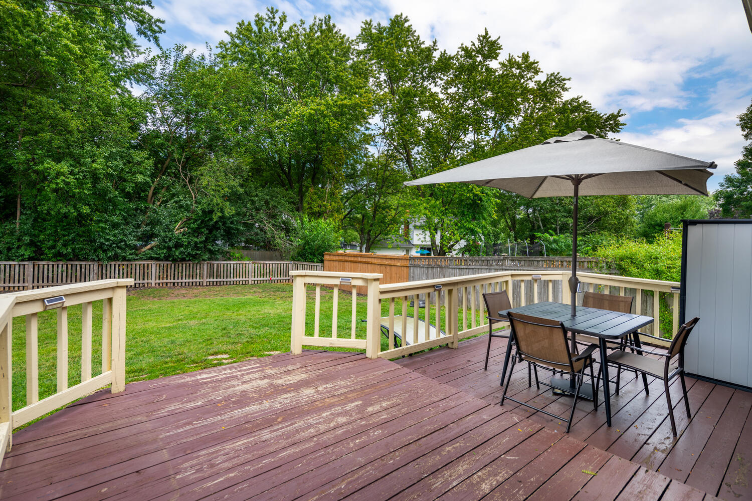 65 Redstart Road Naperville, IL 60565 - Photo 31 of 48 a view of a chair and table on the wooden deck
