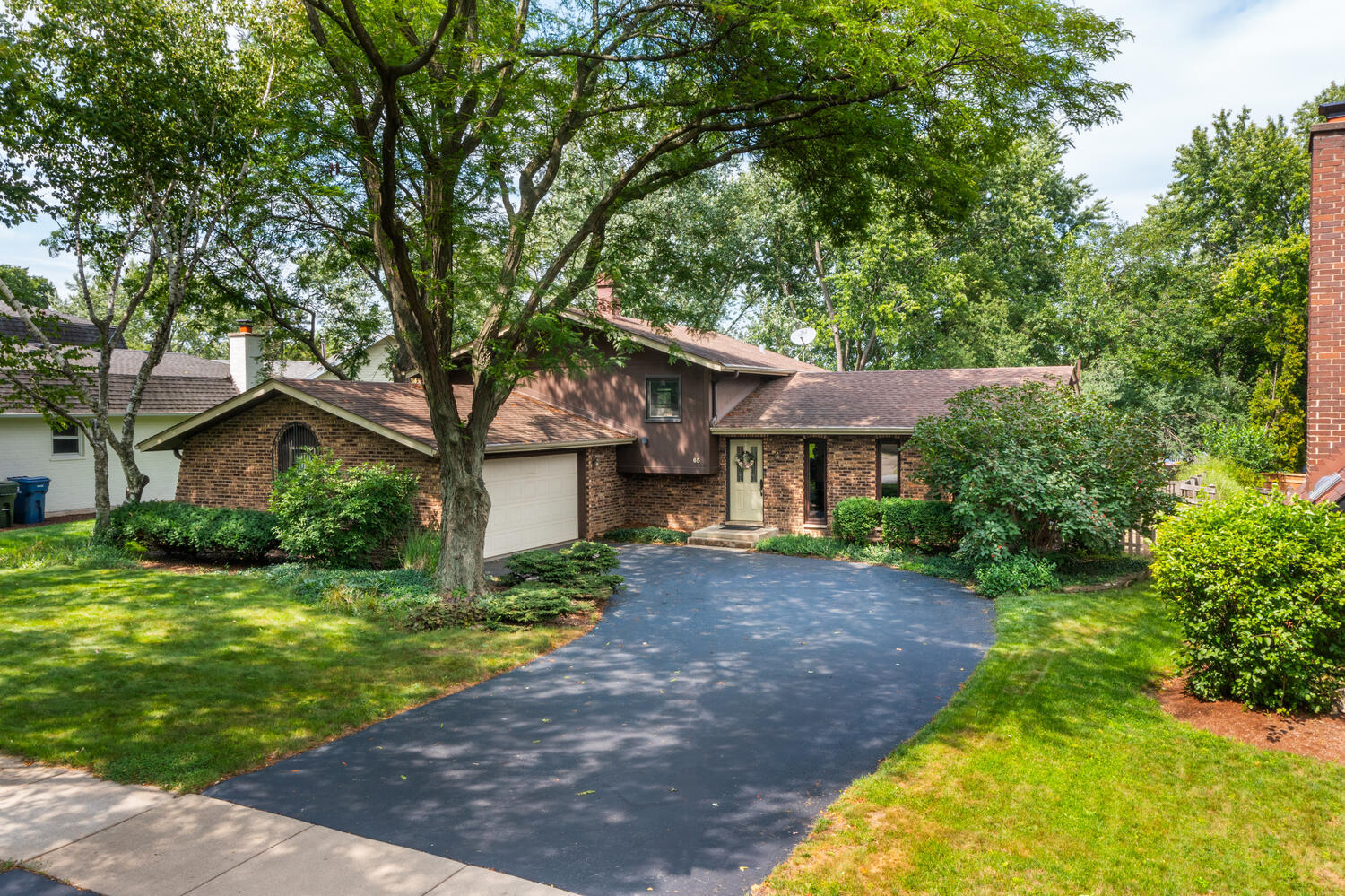 65 Redstart Road Naperville, IL 60565 - Photo 33 of 48 a front view of a house with a garden