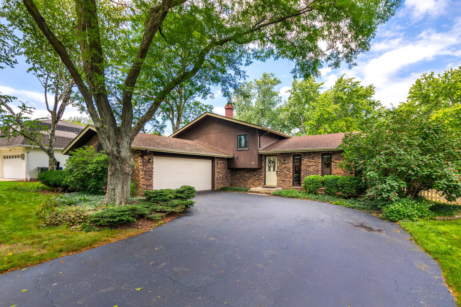 65 Redstart Road Naperville, IL 60565 - Photo 44 of 48 a house view with a garden space