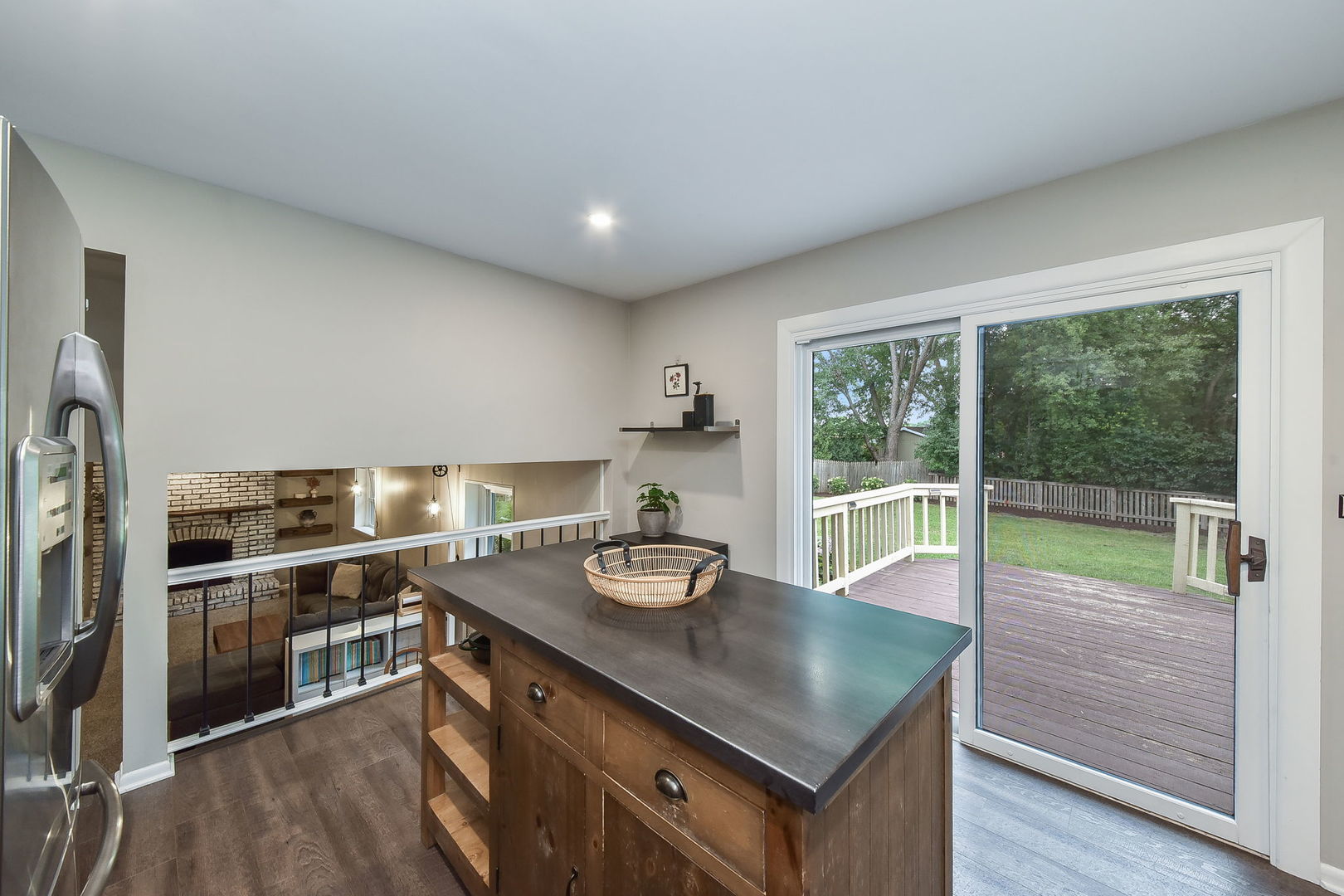 65 Redstart Road Naperville, IL 60565 - Photo 8 of 48 a kitchen with kitchen island a sink appliances and a large window