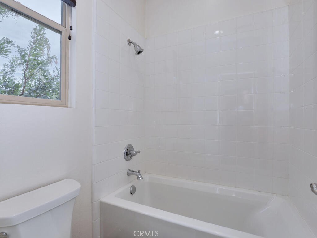 37 Clover Lake Forest, CA 92630 - Photo 26 of 75 a white bath tub sitting next to a toilet