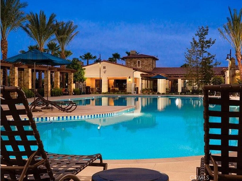 37 Clover Lake Forest, CA 92630 - Photo 37 of 75 a front view of a building with swimming pool and glass windows