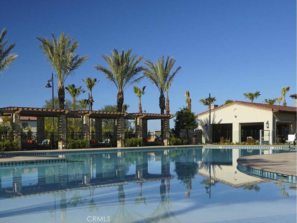 37 Clover Lake Forest, CA 92630 - Photo 41 of 75 a view of a swimming pool with a table and chairs