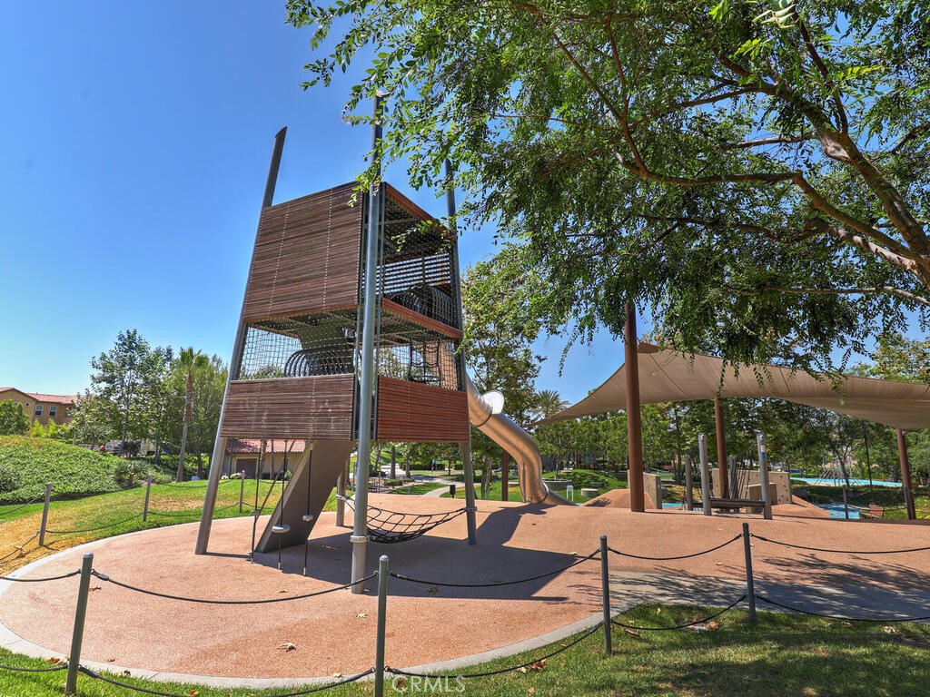 37 Clover Lake Forest, CA 92630 - Photo 55 of 75 a wooden bench sitting in front of a building