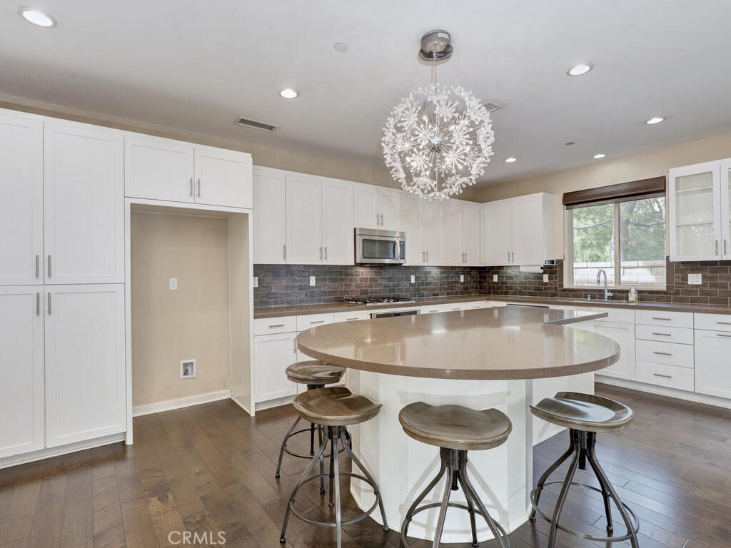 37 Clover Lake Forest, CA 92630 - Photo 6 of 75 a large kitchen with a table and chairs in it