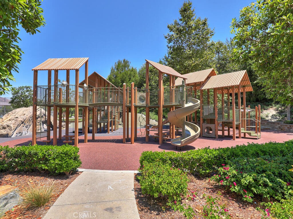 37 Clover Lake Forest, CA 92630 - Photo 71 of 75 a front view of a house with garden and sitting area