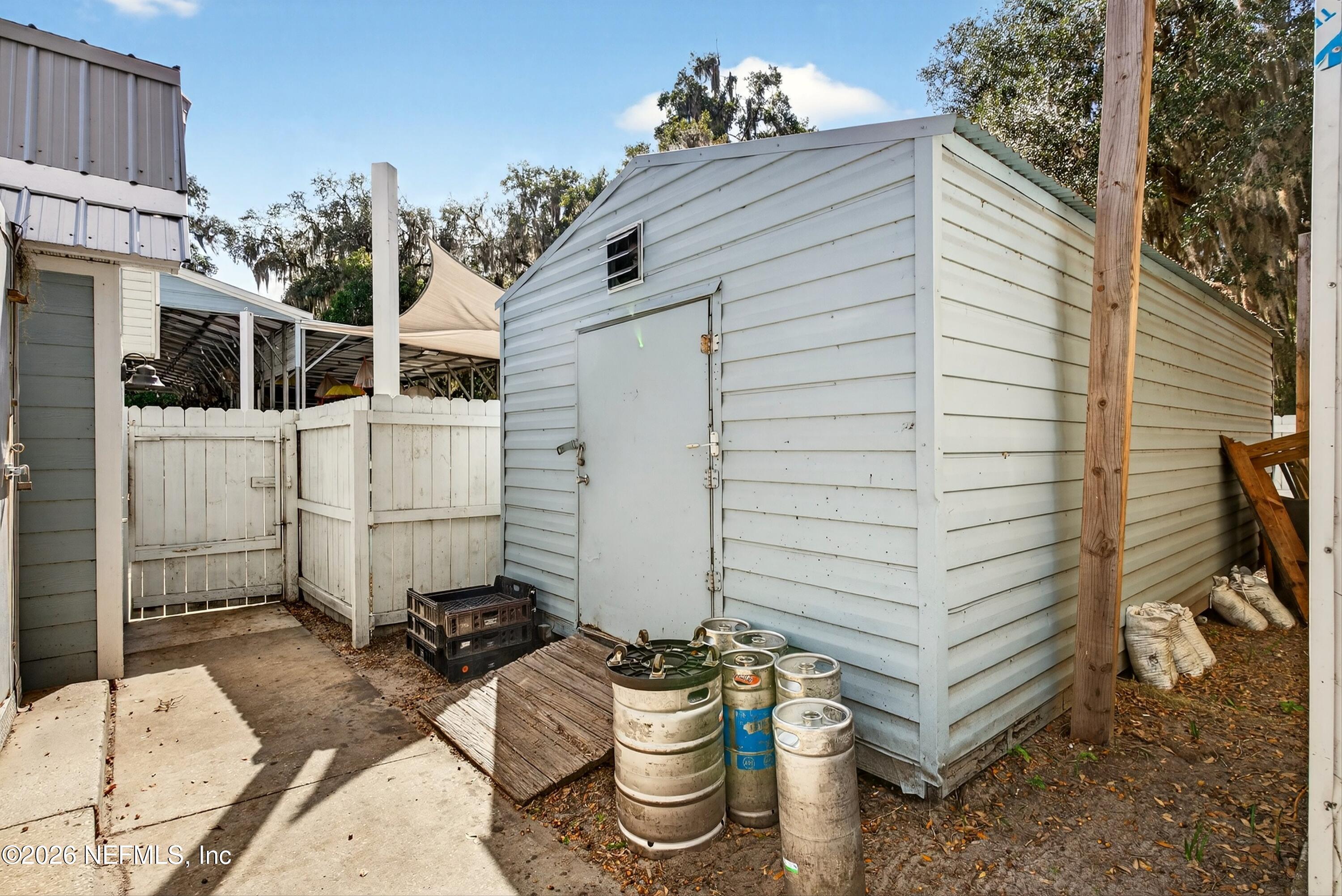 201 Oak Street Welaka, FL 32193 - Photo 109 of 115 a view of a chair and table in the backyard