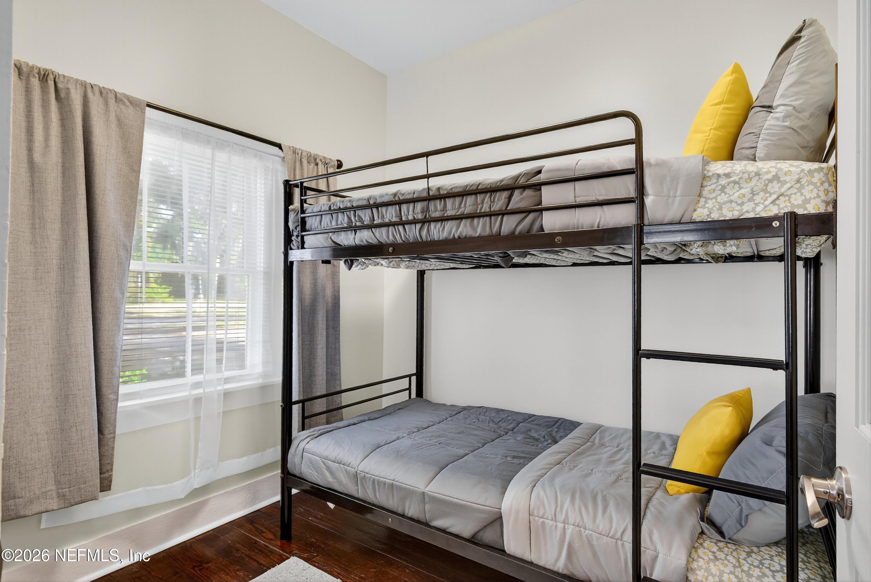 201 Oak Street Welaka, FL 32193 - Photo 11 of 115 a bedroom with a bed and teddy bear on the dresser