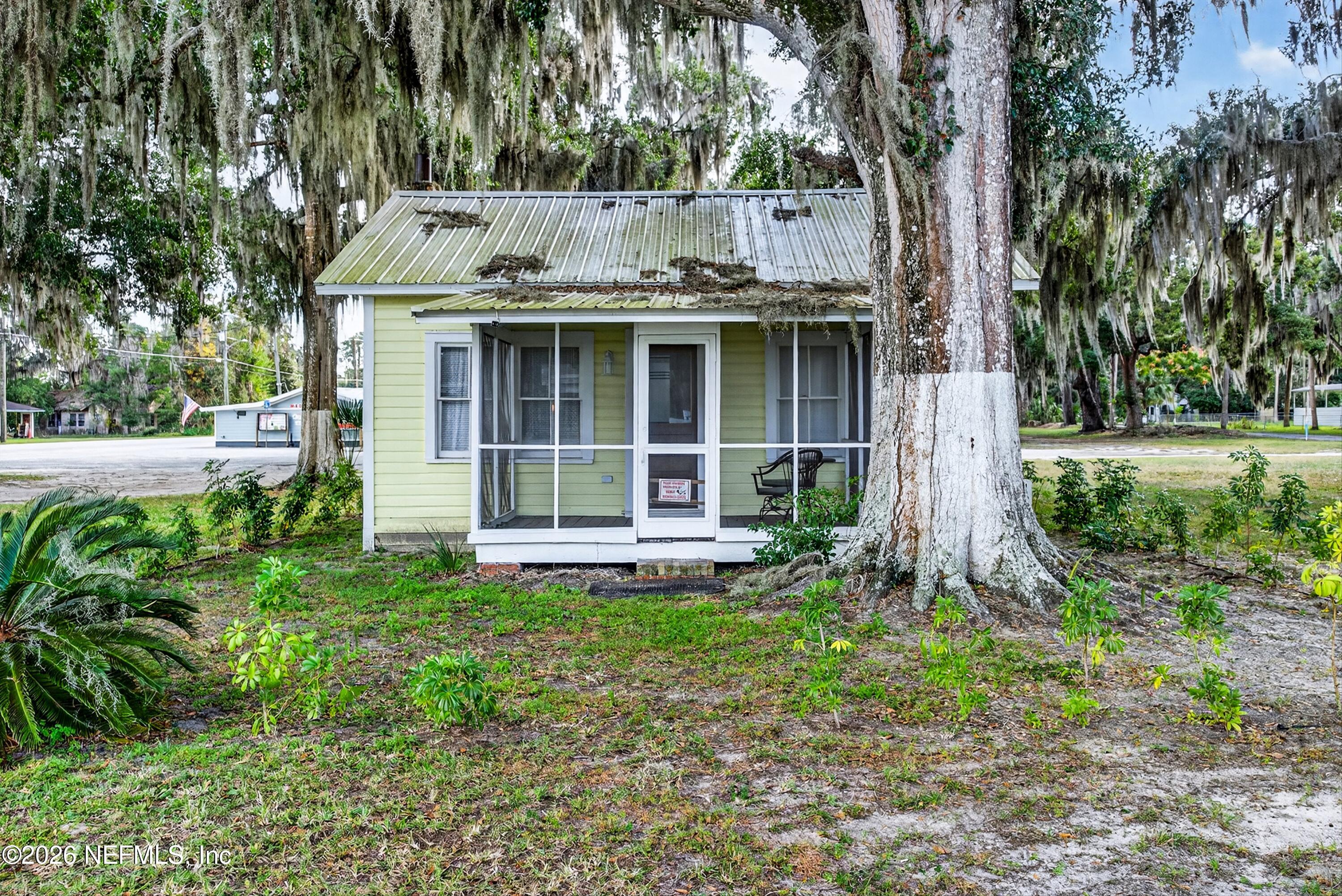 201 Oak Street Welaka, FL 32193 - Photo 2 of 115 a view of a house with yard and sitting area