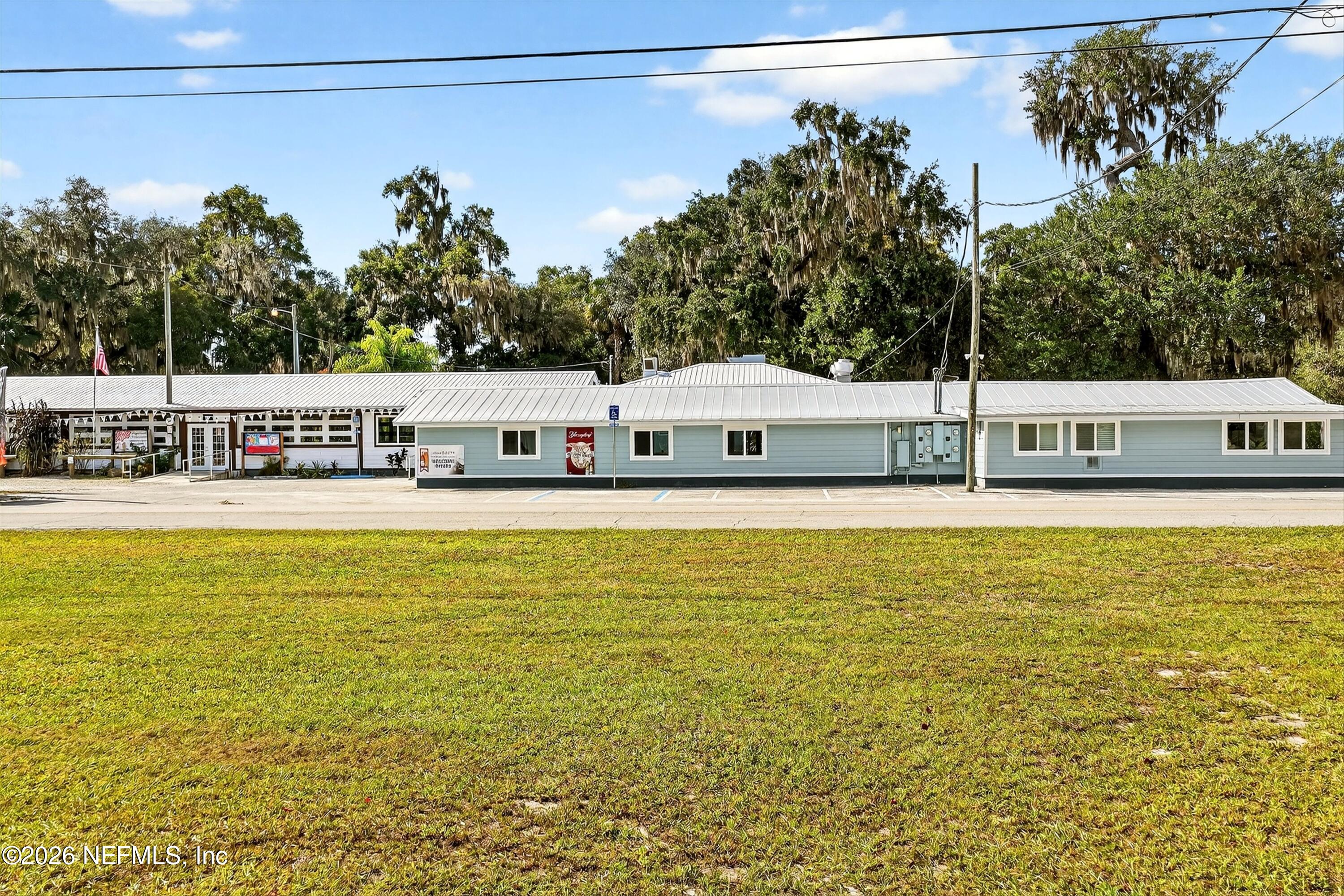 201 Oak Street Welaka, FL 32193 - Photo 23 of 115 a view of a large swimming pool with a lawn chairs