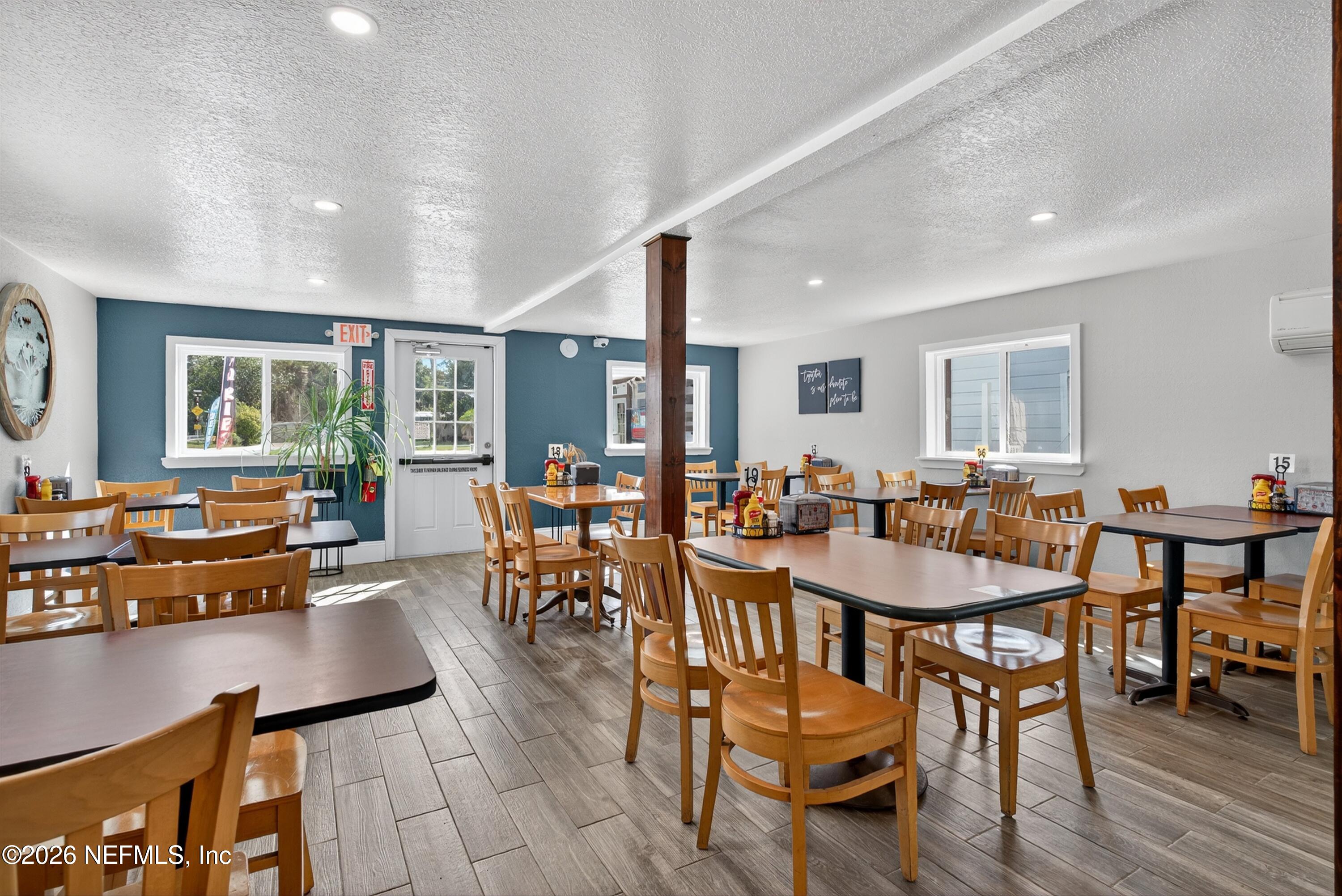 201 Oak Street Welaka, FL 32193 - Photo 31 of 115 a view of a dining room with furniture and wooden floor
