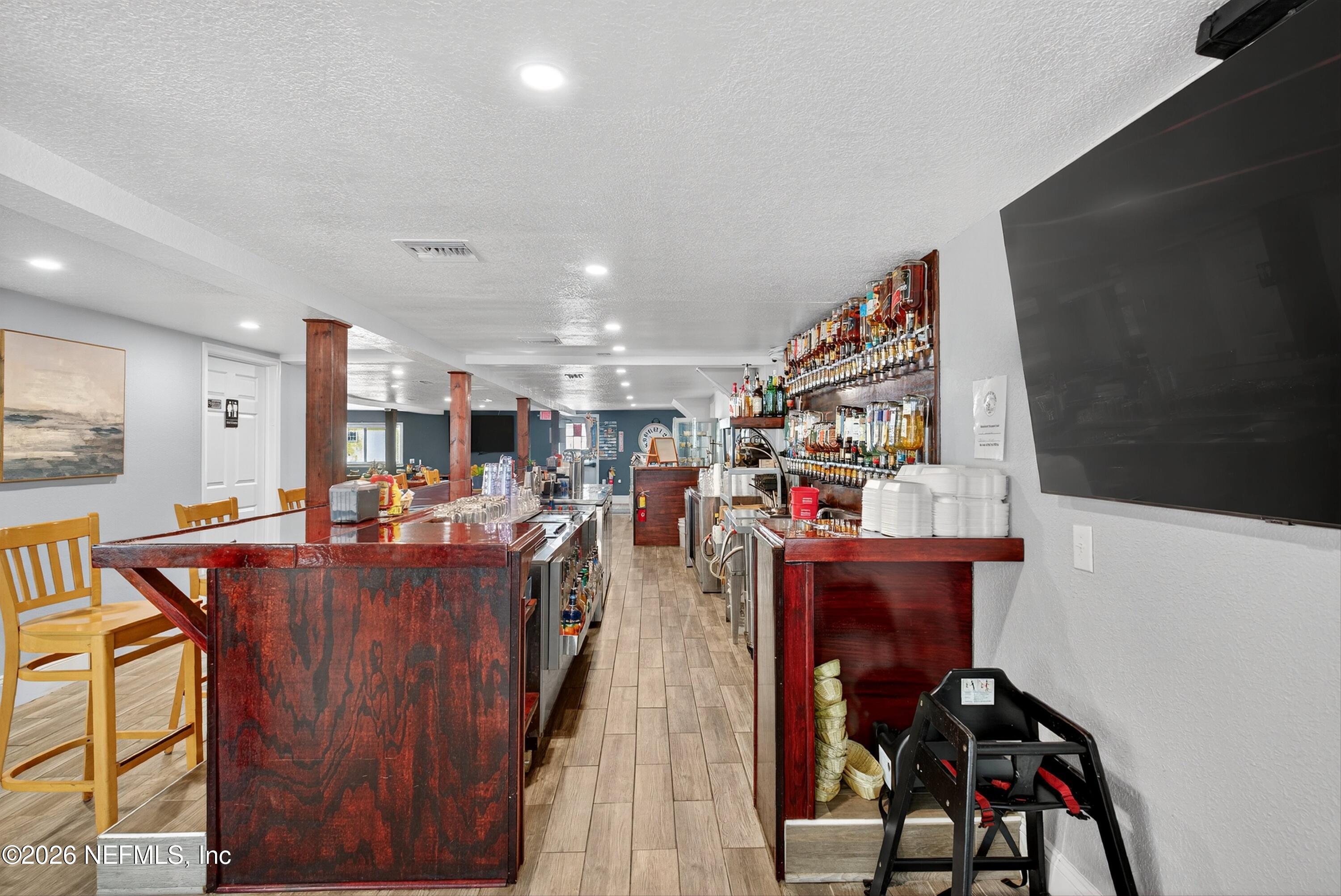 201 Oak Street Welaka, FL 32193 - Photo 33 of 115 a view of a dining room with furniture and a kitchen