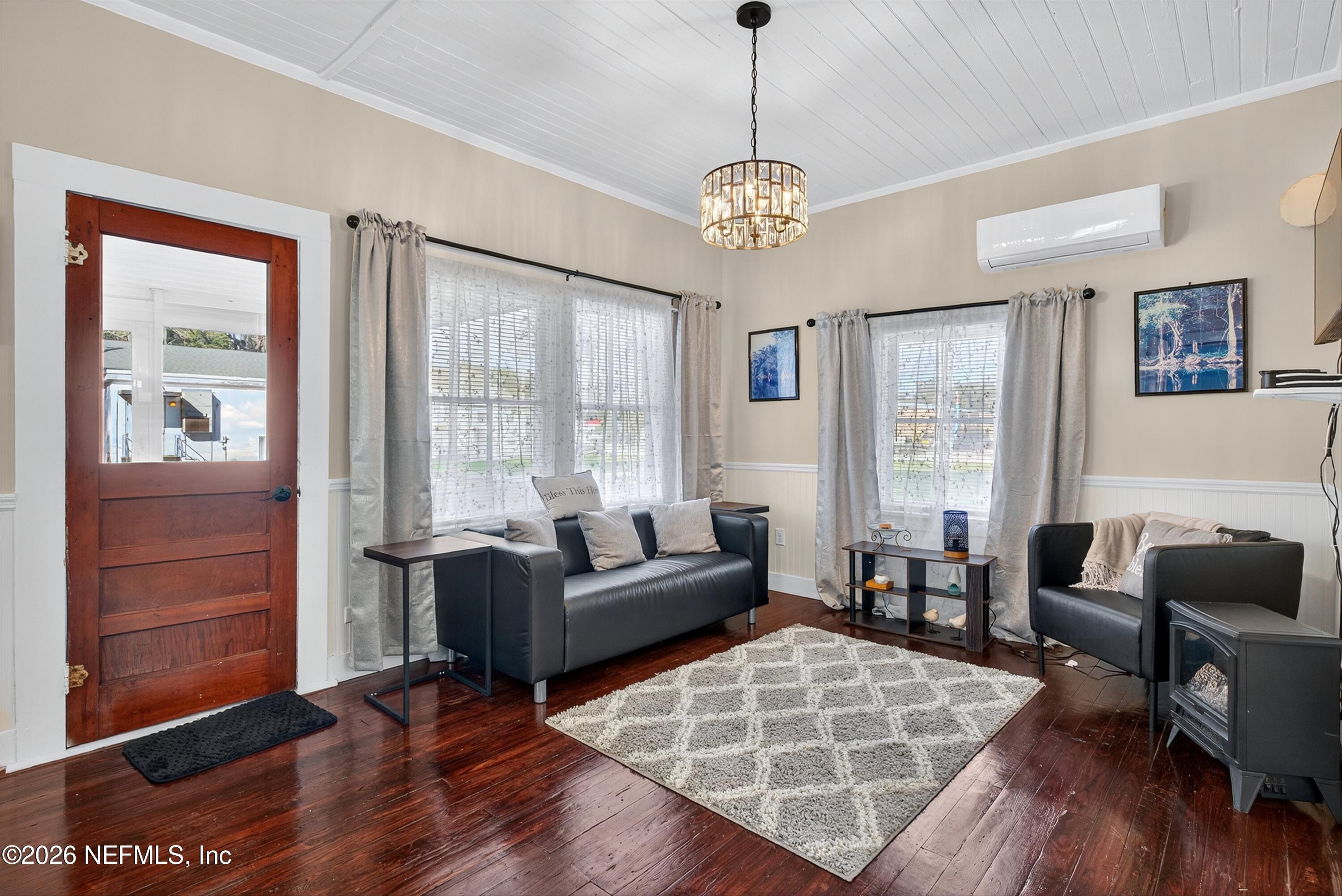 201 Oak Street Welaka, FL 32193 - Photo 4 of 115 a living room with furniture a wooden floor and a large window