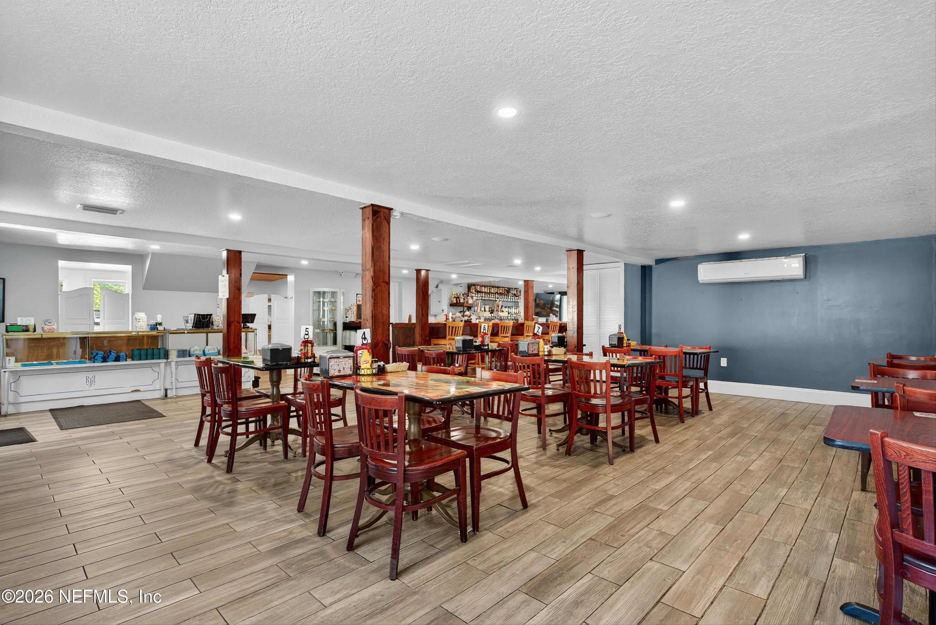 201 Oak Street Welaka, FL 32193 - Photo 41 of 115 a view of a dining area with furniture window and wooden floor