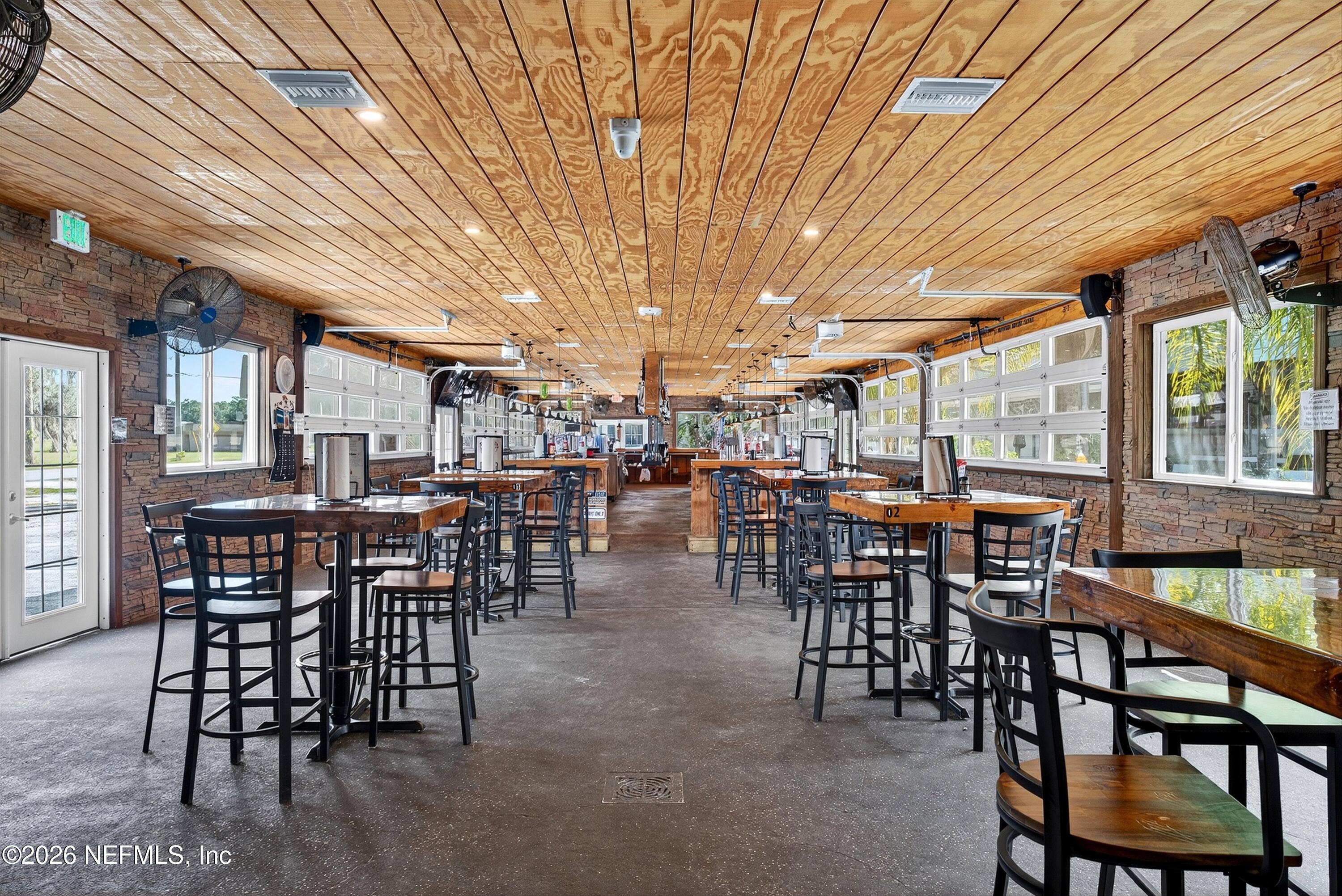 201 Oak Street Welaka, FL 32193 - Photo 47 of 115 a view of a dining room with furniture window and outdoor seating