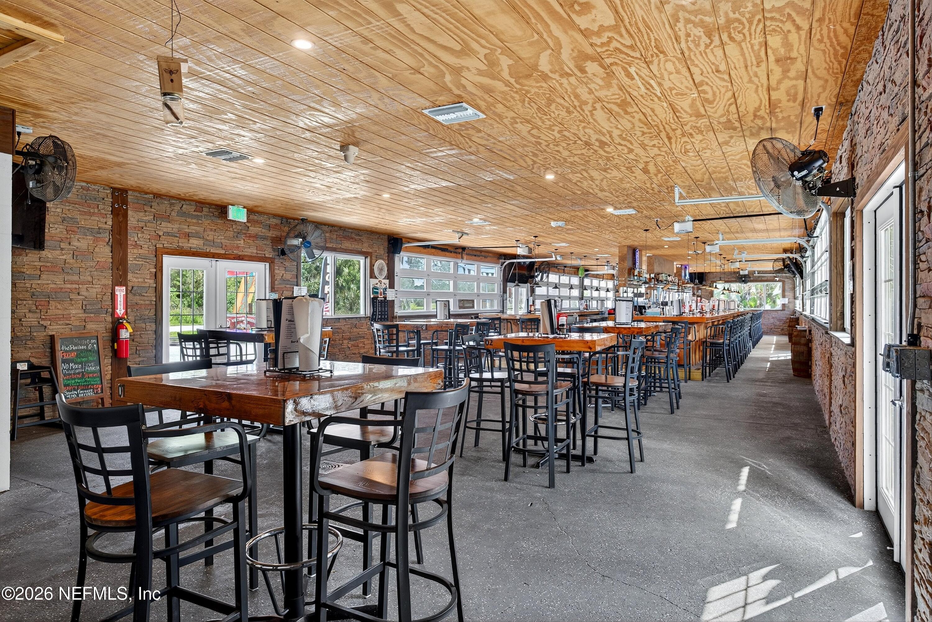 201 Oak Street Welaka, FL 32193 - Photo 48 of 115 a view of a dining area with furniture and chandelier