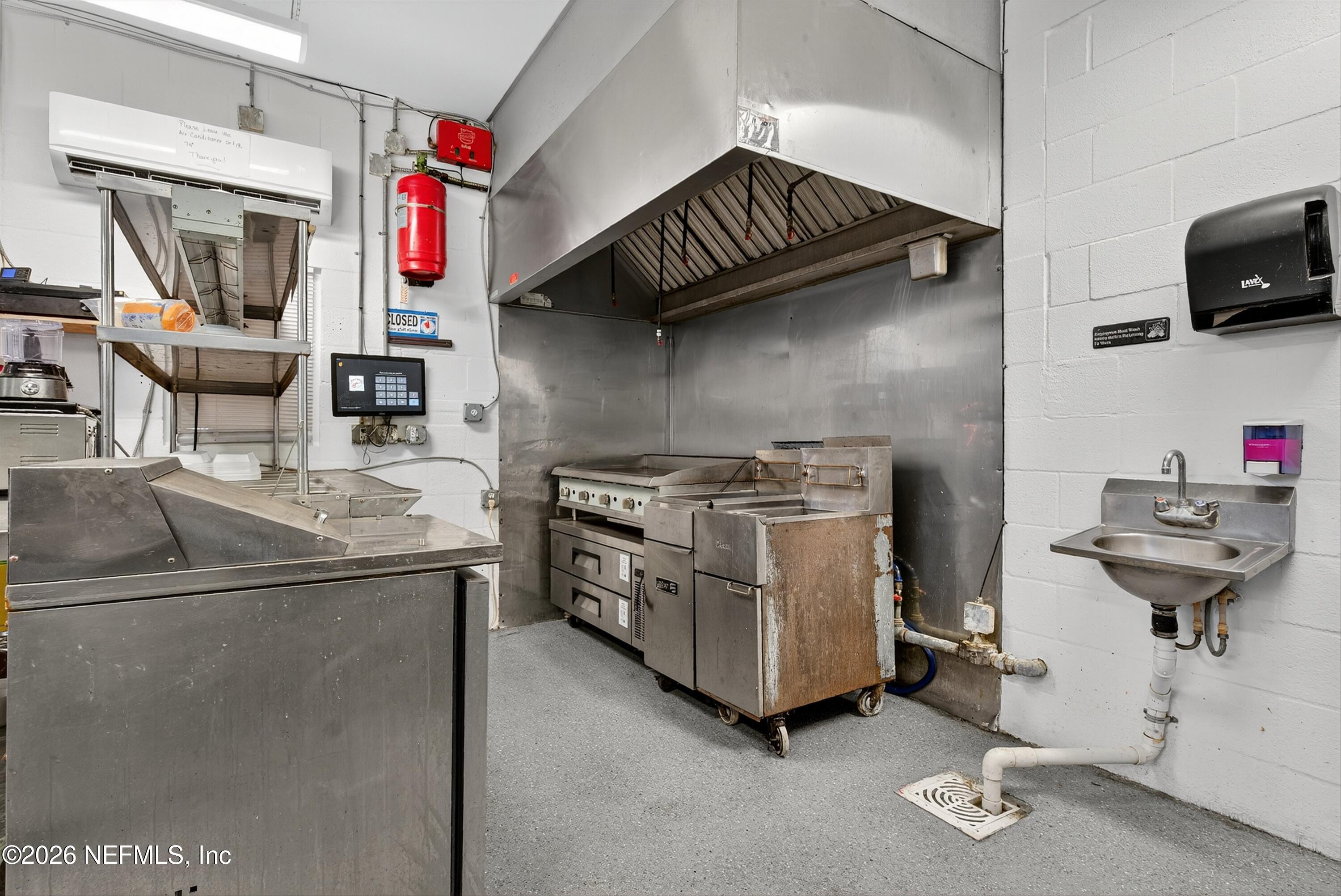 201 Oak Street Welaka, FL 32193 - Photo 86 of 115 a kitchen with stainless steel appliances granite countertop a sink and a stove