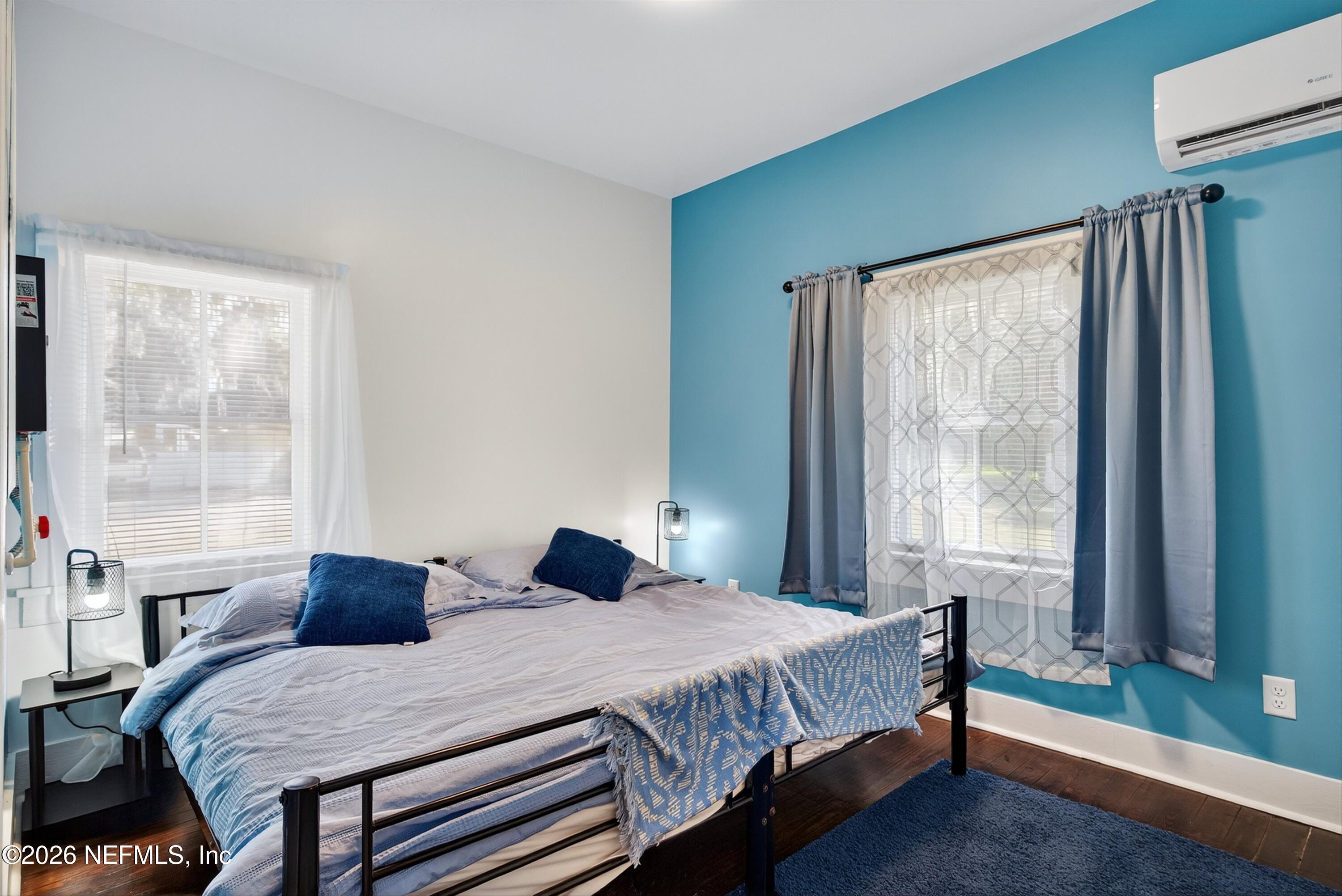 201 Oak Street Welaka, FL 32193 - Photo 9 of 115 a bedroom with a bed a window and walk in closet