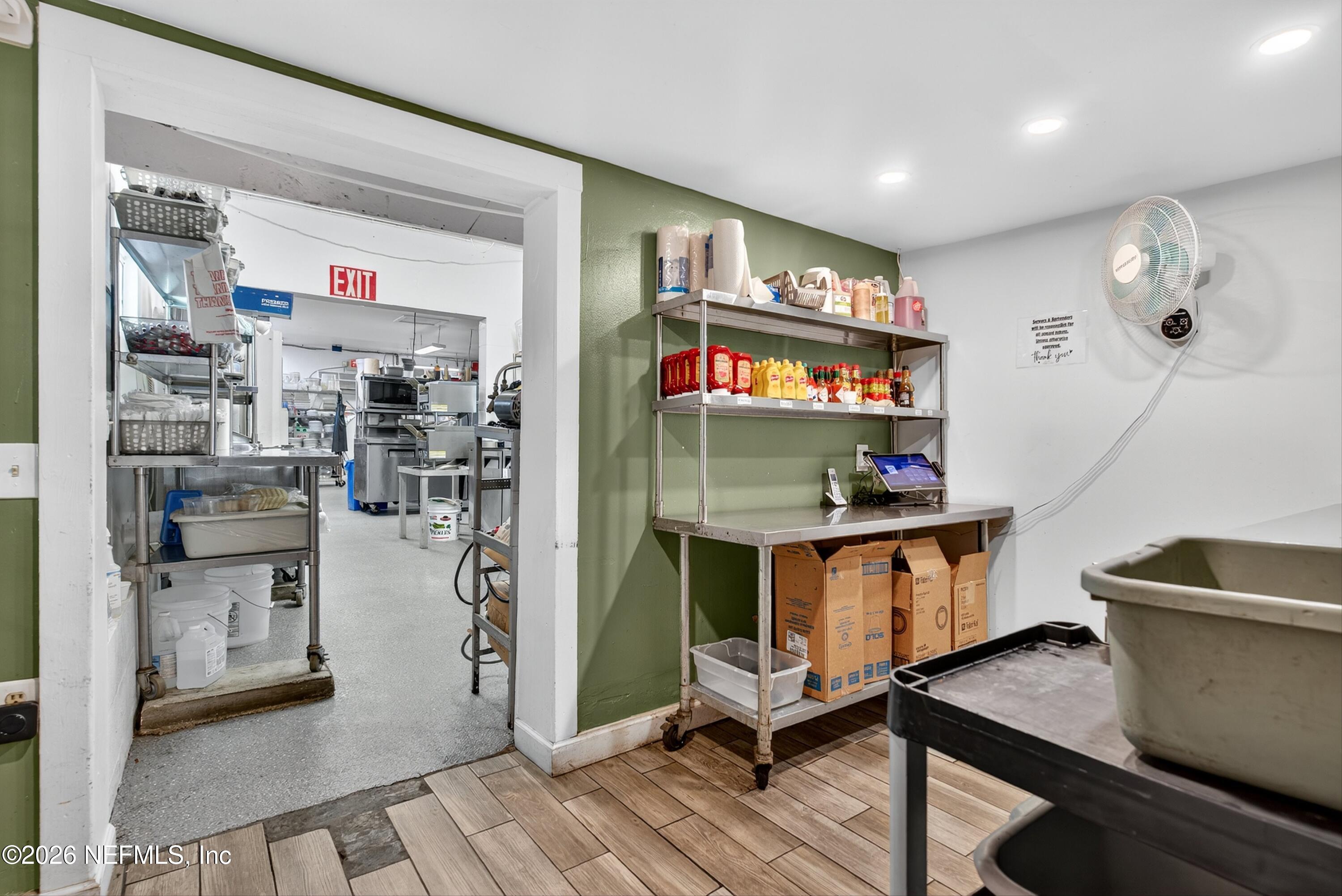 201 Oak Street Welaka, FL 32193 - Photo 100 of 115 a room with stainless steel appliances lots of wooden furniture