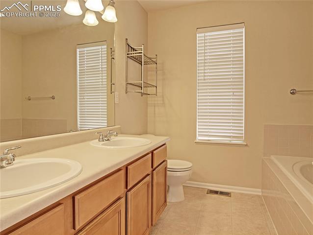 686 Pebble Crest Way Colorado Springs, CO 80921 - Photo 20 of 30 Double sinks, soaking tub and free standing shower not shown in photo to the right.