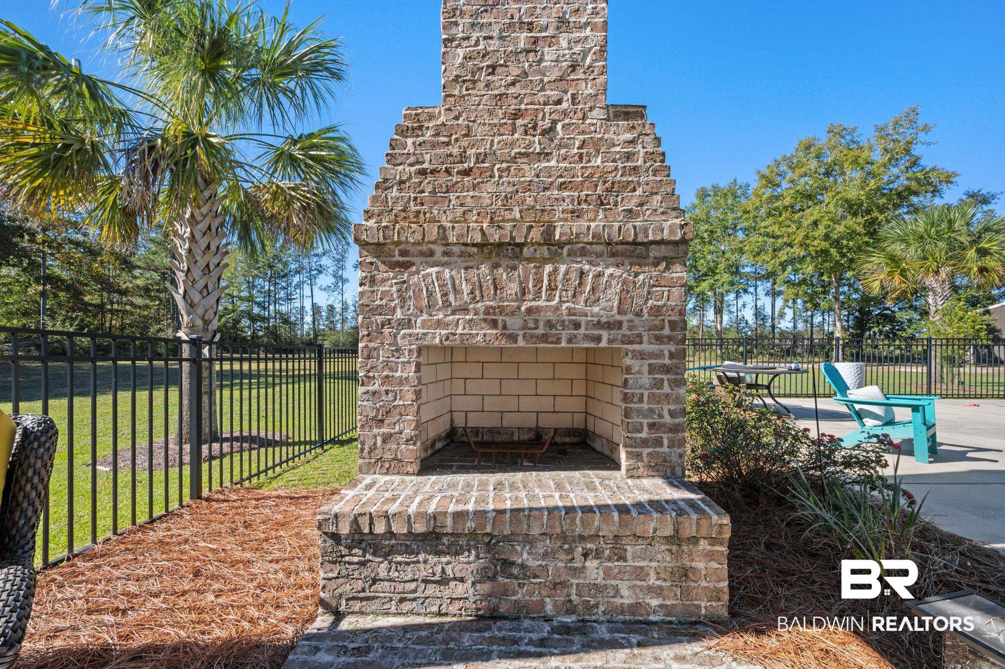 38211-d) V R Byrd Road Bay Minette, AL 36507 - Photo 35 of 58 View of patio / terrace with an outdoor brick fireplace