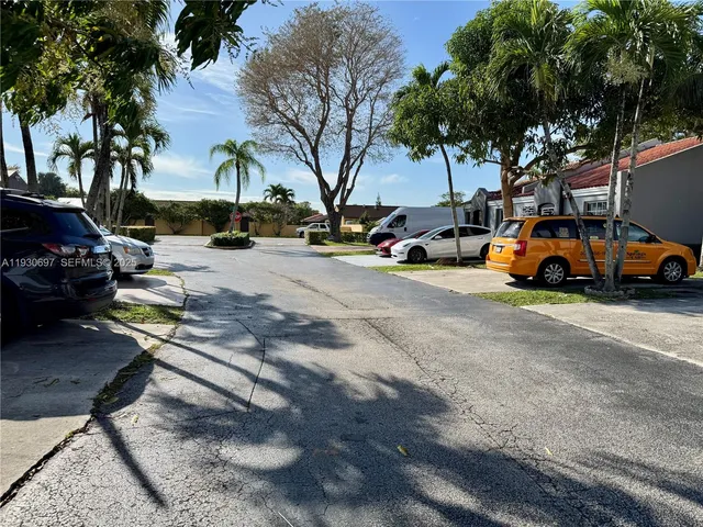 a view of a street with cars