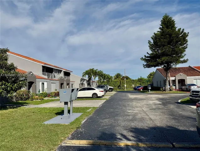 a front view of a house with garden and porch