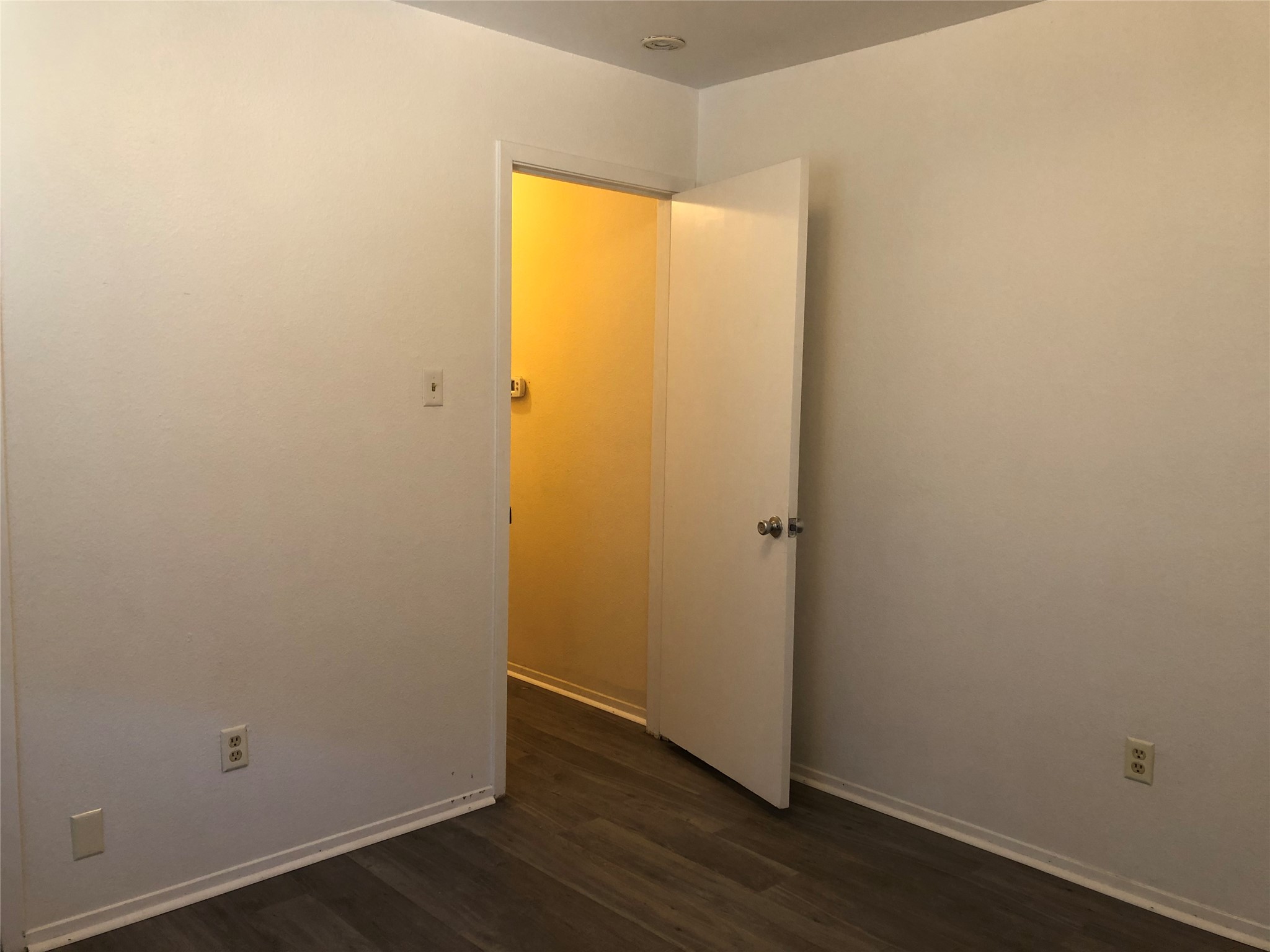 718 Decker Prairie Drive Austin, TX 78748 - Photo 13 of 22 Unfurnished room featuring baseboards and dark wood finished floors