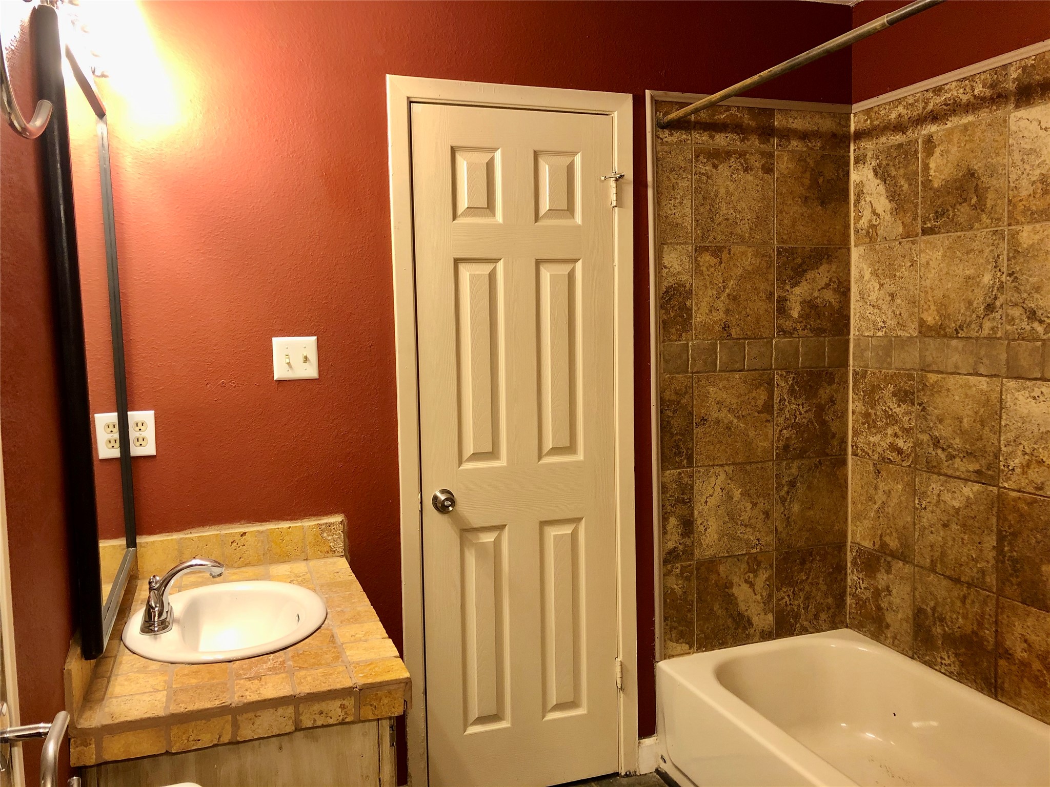 718 Decker Prairie Drive Austin, TX 78748 - Photo 15 of 22 Bathroom with vanity, a textured wall, and bathtub / shower combination