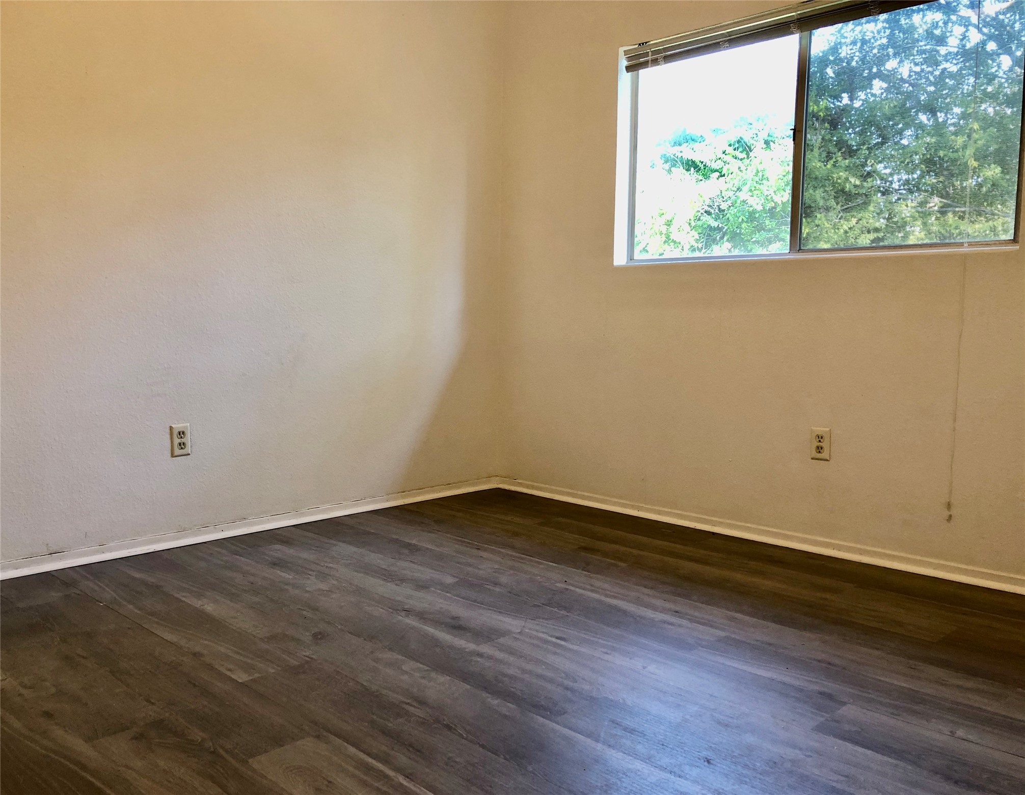 718 Decker Prairie Drive Austin, TX 78748 - Photo 9 of 22 Empty room with dark wood-style floors