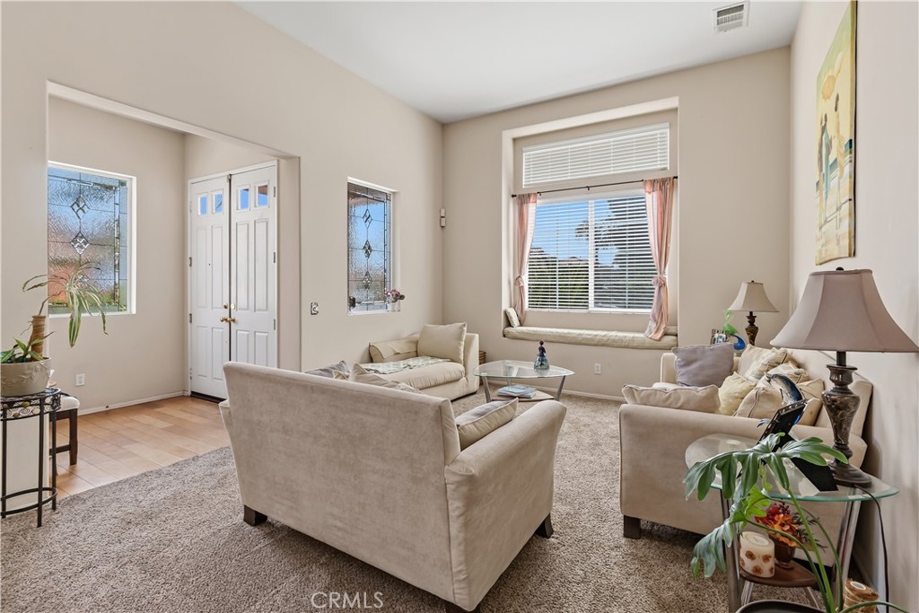 152 Alabaster Loop Perris, CA 92570 - Photo 4 of 29 a living room with furniture and a window