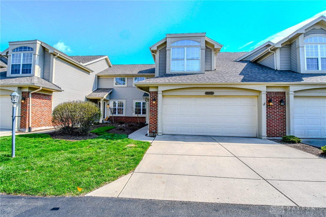 This charming home offers a garage and well-maintained lawn, perfect for comfortable living.