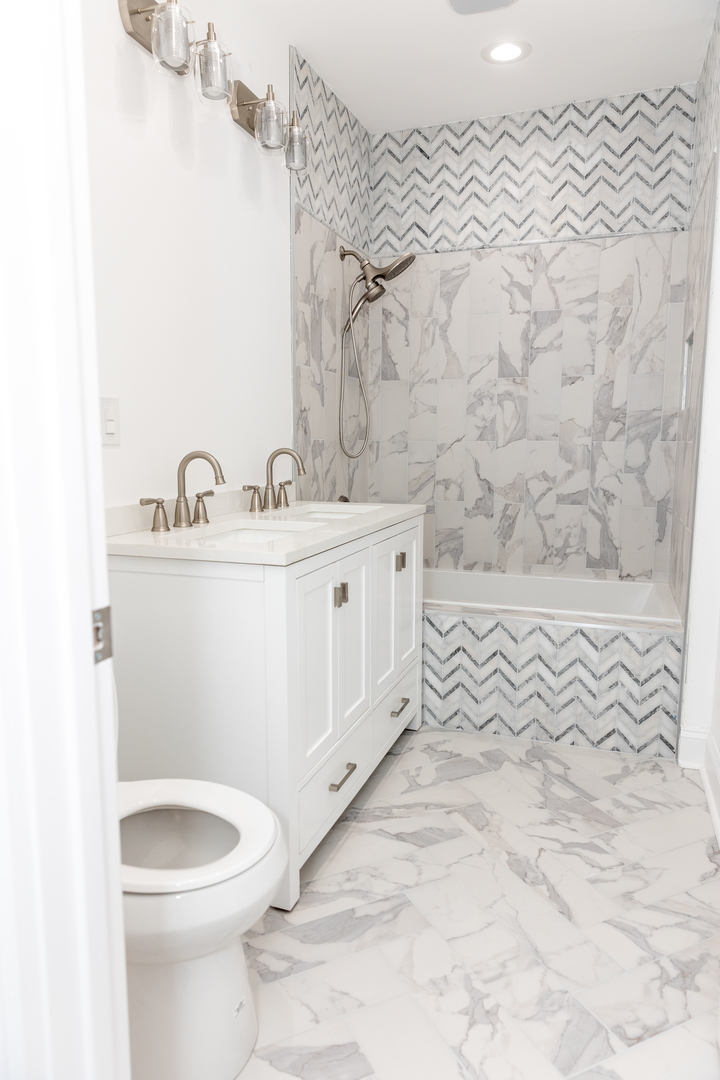 12124 South Stewart Avenue Chicago, IL 60628 - Photo 42 of 71 a bathroom with a sink a toilet and mirror