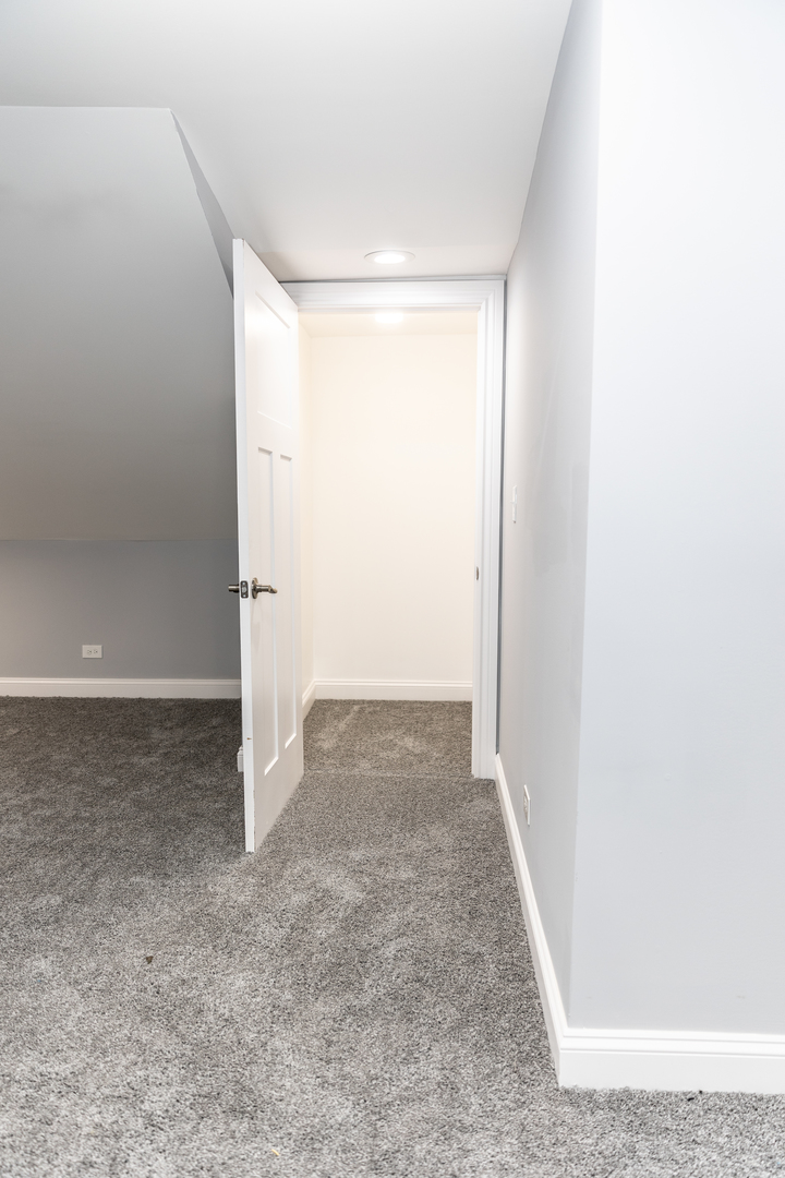 12124 South Stewart Avenue Chicago, IL 60628 - Photo 54 of 71 an empty room with an entrance to other room