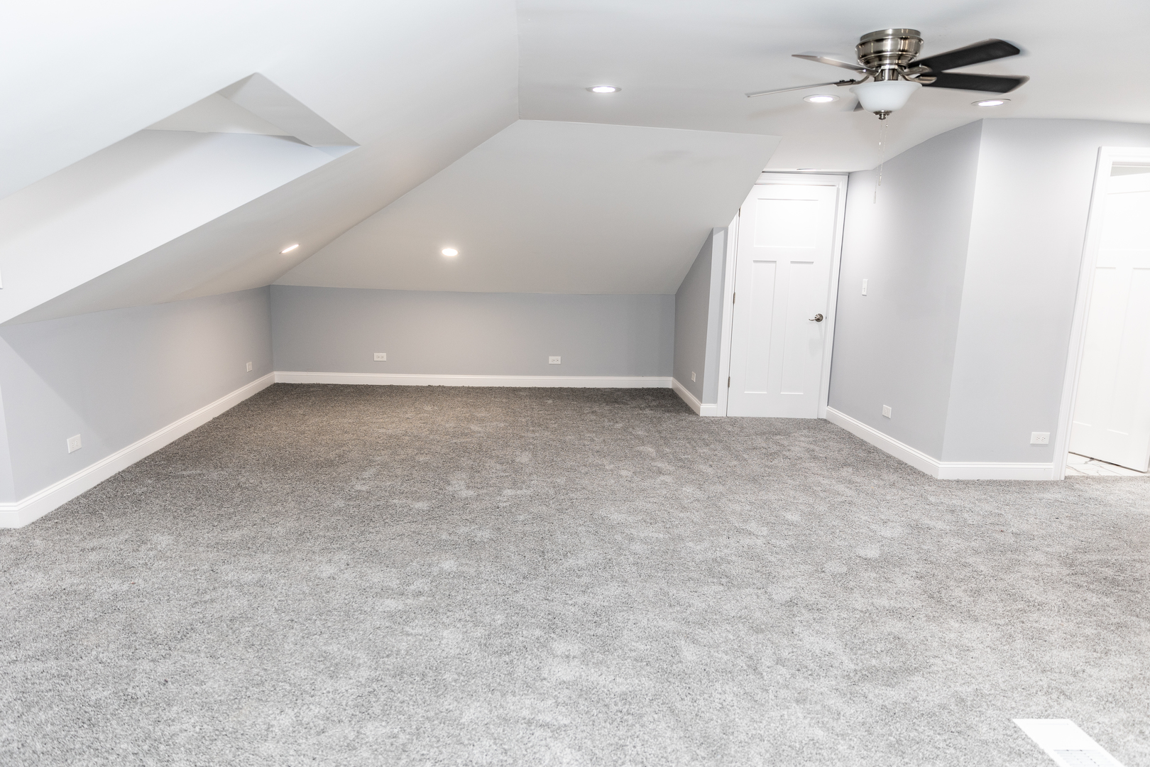 12124 South Stewart Avenue Chicago, IL 60628 - Photo 58 of 71 an empty room with a ceiling fan and bathroom view