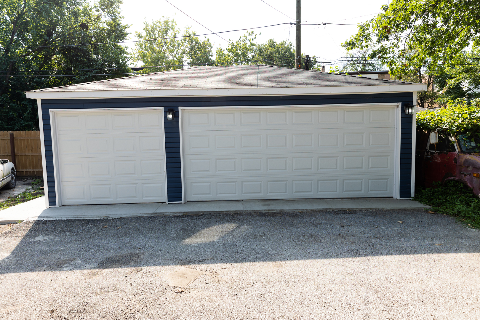 12124 South Stewart Avenue Chicago, IL 60628 - Photo 6 of 71 a side view of a house with a garage