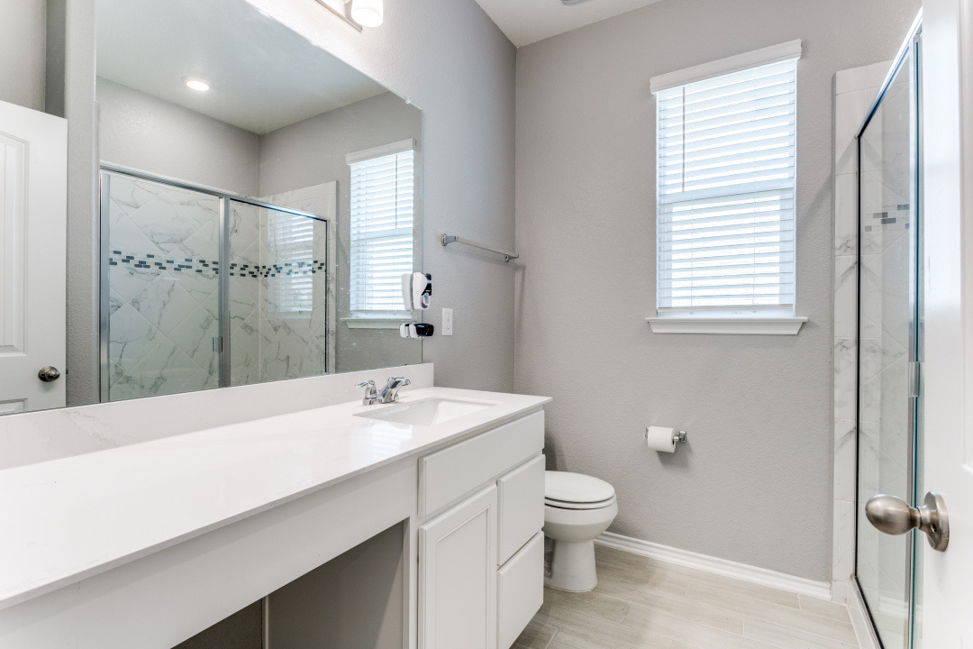 1100 Desaix Drive Georgetown, TX 78628 - Photo 17 of 25 a bathroom with a sink a toilet and shower
