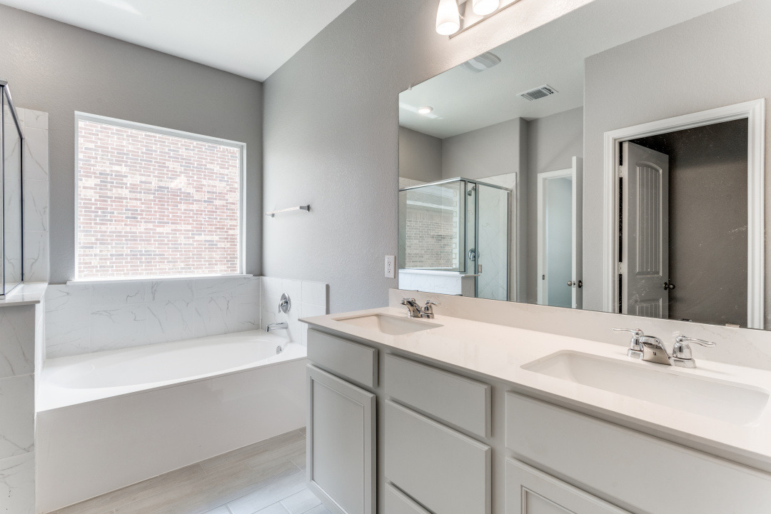 1100 Desaix Drive Georgetown, TX 78628 - Photo 22 of 25 a bathroom with a bathtub and a sink