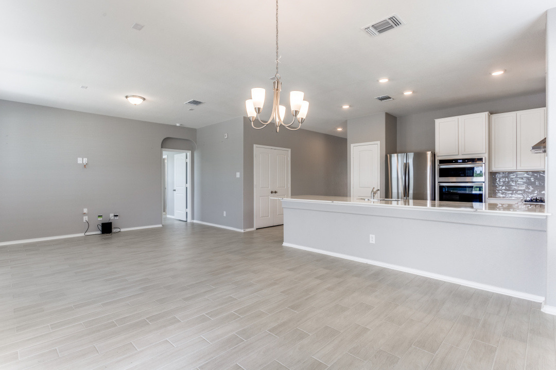 1100 Desaix Drive Georgetown, TX 78628 - Photo 5 of 25 a view of a kitchen with stainless steel appliances a large counter top